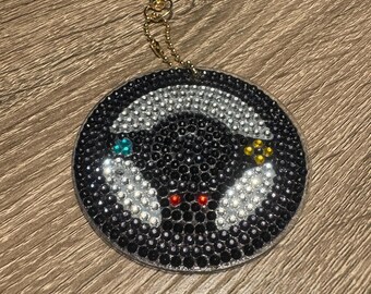 Llavero de doble cara con mando de juego