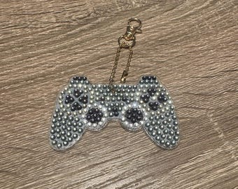 Llavero de doble cara con mando de juego