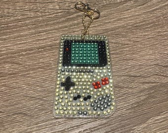 Llavero de doble cara con mando de juego