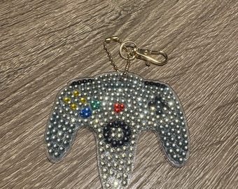 Llavero de doble cara con mando de juego