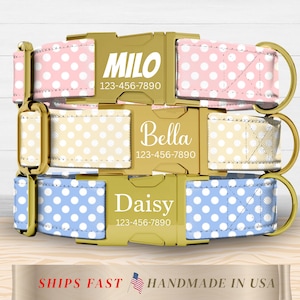 May include: Three personalized dog collars in pink, yellow, and blue with white polka dots. Each collar features a gold-colored buckle engraved with a name and phone number. The collars are labeled "Milo", "Bella", and "Daisy".