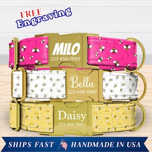 May include: Three personalized dog collars with gold-coloured buckles. The top collar is pink with a bee pattern and the name "Milo". The middle collar is white with a bee pattern and the name "Bella". The bottom collar is yellow with a bee pattern and the name "Daisy".