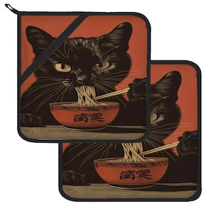 May include: Two black cat pot holders with a red background. Each cat is holding chopsticks and eating noodles from a red bowl with the word "美味" written on it.
