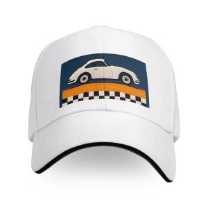 May include: White baseball cap featuring a graphic of a vintage white car on a blue background with an orange stripe and checkered pattern. The cap has a black brim and is made of a durable fabric.