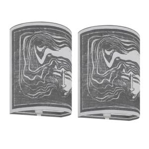 May include: Two gray lampshades with a rectangular shape and a white border. Each lampshade features a black and white print of a face with long flowing hair. The design has a woodcut style.