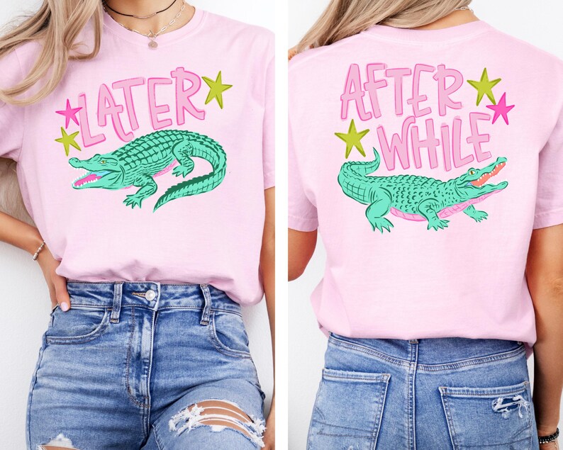 May include: Pink t-shirt featuring a green alligator graphic with the text "LATER" on the front and "AFTER WHILE" on the back. The design includes pink text and star accents.