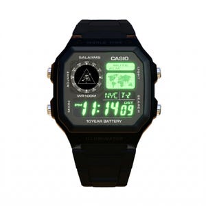 May include: Black digital watch with a square face. The watch displays the time in green numerals, along with the text "CASIO", "5ALARMS", and "10 YEAR BATTERY". The watch has silver buttons and a black band.