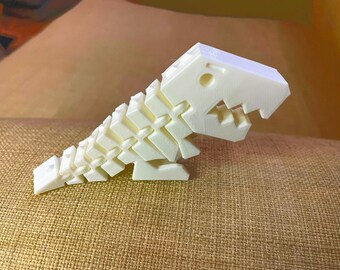 White Flexi Rexi. Great fidget for all ages. Small size. Dino fidget toy.