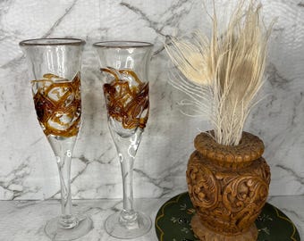 Set of 2 vintage hand blown champagne flutes with brown swirl design