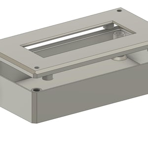 May include: A light gray rectangular enclosure with a partially open lid. The lid has a rectangular cutout and is secured by screws. A cylindrical knob is on the side. This appears to be an electronic component housing.