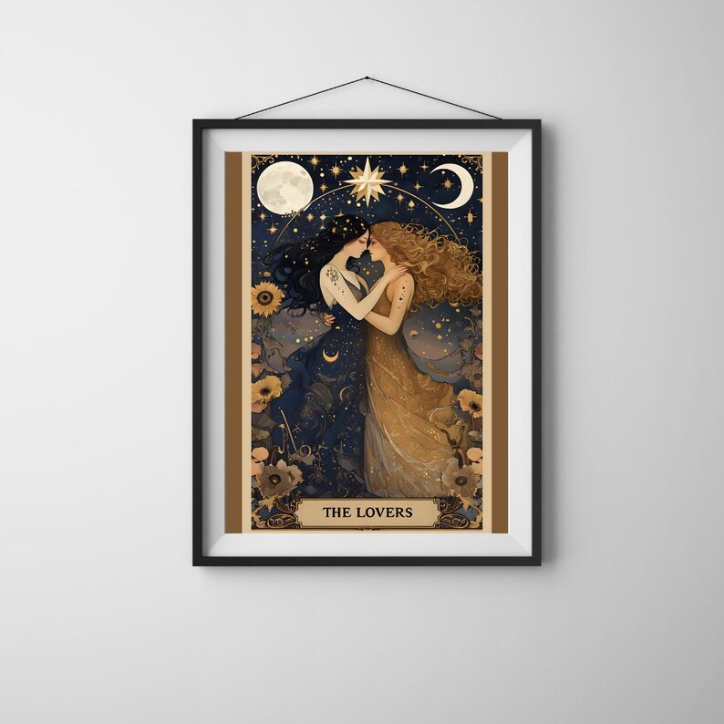 The Lovers Sapphic Art Print, Lesbian Wedding Gift, Whimsigoth Decor, Queer Art Poster. A beautifully illustrated sapphic art print that blends whimsigoth decor, celestial romance, and vintage aesthetics. Featuring two lovers entwined beneath a dreamy night sky, this piece radiates warmth, connection, and cosmic harmony. Displayed in simple black frame on neutral wall.