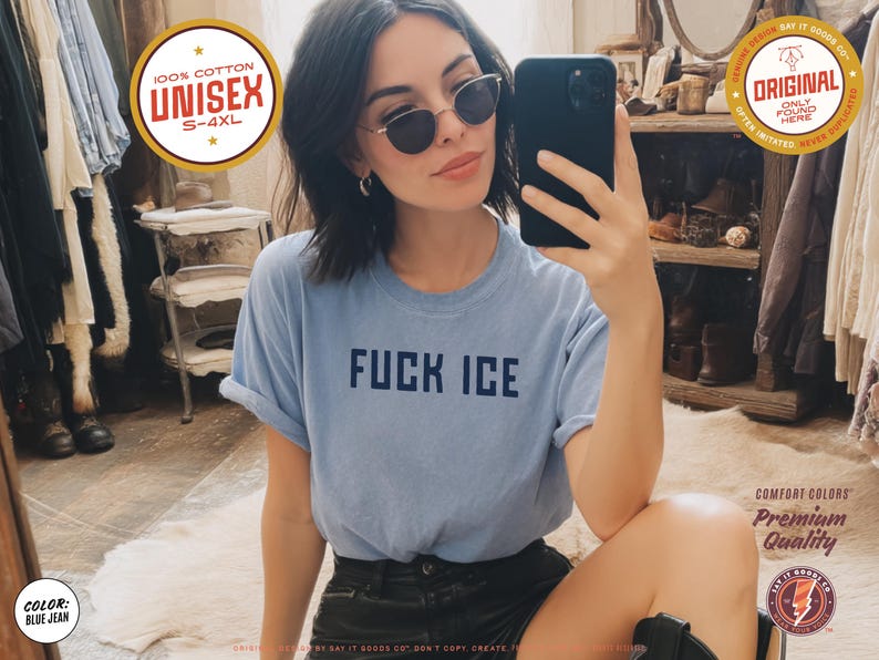 May include: Light blue unisex t-shirt with the text "FUCK ICE" in navy blue. The shirt is made of 100% cotton and is available in sizes S-4XL. The image also includes a round gold sticker that says "ORIGINAL ONLY FOUND HERE".