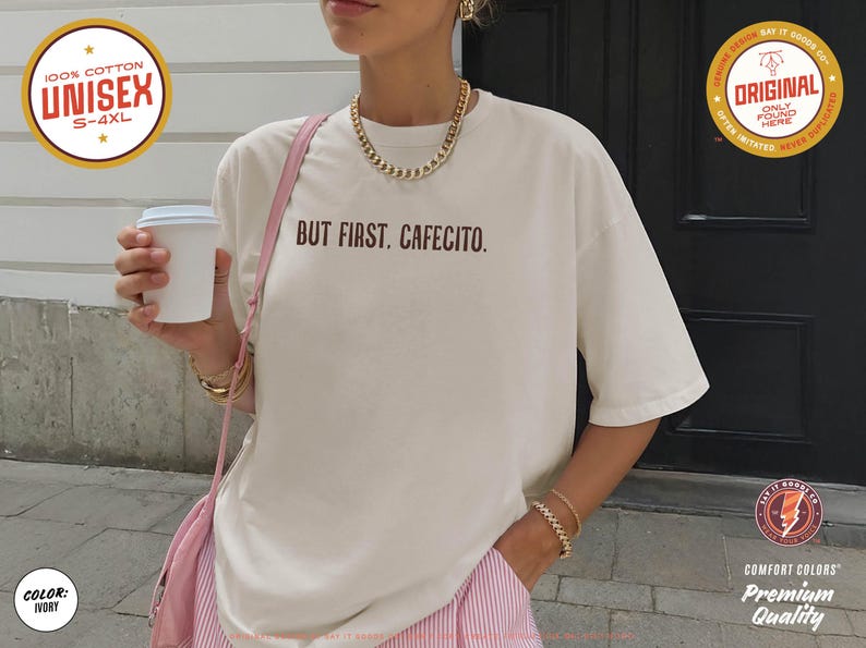 Minimalist “But First. Cafecito.” graphic tee in espresso brown featuring cream typography. Latina coffee lover shirt celebrating Hispanic culture and morning cafecito ritual. Modern unisex coffee shirt perfect for espresso lovers, brunch outfits, and gift ideas for moms, sisters, and café fans.
