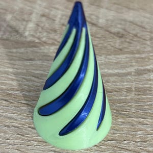 May include: A light green cone with a blue spiral design. The cone is made of plastic and has a smooth surface.