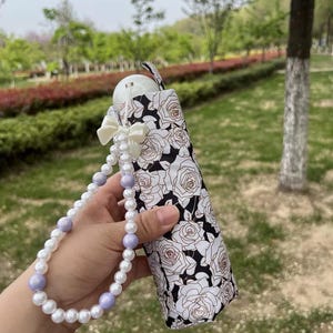 Compact Floral Sun Umbrella: UPF50+ UV Protection, Pearl Handle