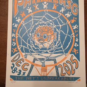 May include: A blue and orange print featuring a basketball hoop with a pufferfish inside. The text reads "PHMS MSG DEC 28-31 2015" and "THE NET'S UNBREAKABLE!" The print is numbered 40/55 and signed "SNIFFIN '25".