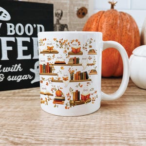 Ghost pattern mug gift with ghosts floating around reading books, or on top of shelves with a Halloween backdrop.