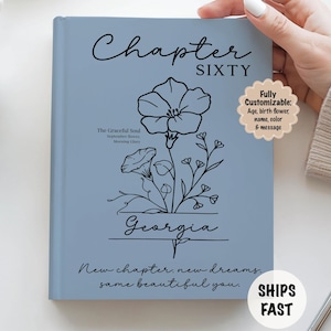 May include: A light blue journal with the words "Chapter SIXTY" in black script. A black floral illustration and the name "Georgia" are featured. Text includes "New chapter, new dreams, same beautiful you."