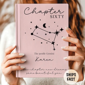 May include: A pink book cover with the words "Chapter SIXTY" in black script. Below, a constellation graphic and the text "The gentle Gemini Karen." The bottom reads "New chapter, new dreams, same beautiful you."