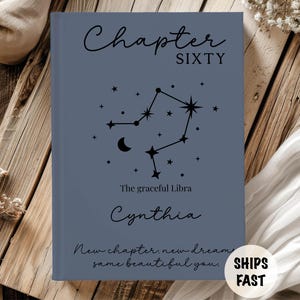 May include: A blue book with the text "Chapter SIXTY" and "Cynthia" in black script. A constellation design is featured with the words "The graceful Libra" and "New chapter, new dreams, same beautiful you."
