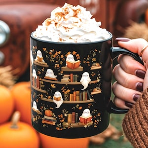 Halloween mug gift with a cute ghosts reading books pattern.