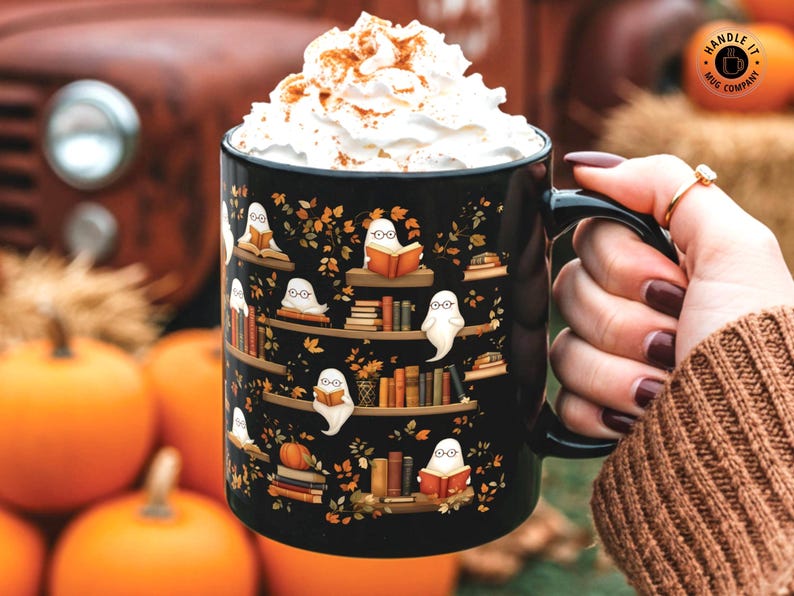 Halloween mug gift with a cute ghosts reading books pattern.