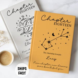 May include: Two hardcover books with the text Chapter Eighteen. One book is white with a black fish illustration, the other is mustard yellow with a black Scorpio constellation and the name Lucy printed on the front cover with additional text.