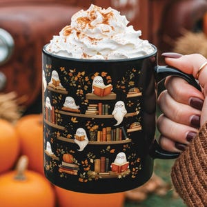 Halloween mug gift with a cute ghosts reading books pattern.