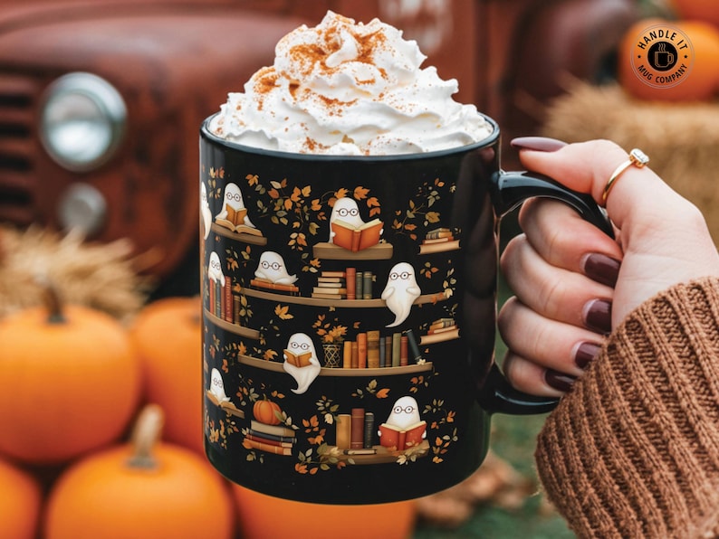 Halloween mug gift with a cute ghosts reading books pattern.