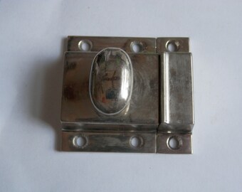 cast brass cupboard latch with a polished nickel finish vintage