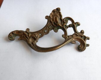 One (1) antique cast brass French styled drawer pull 3 inch centers