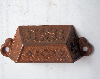 one (1) antique original cast iron bin pull with copperish finish vintage