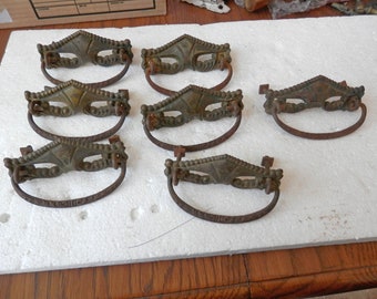 7 matching antique brass and iron drawer pulls 3 inch centers