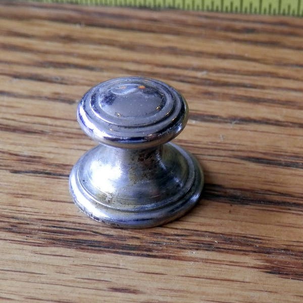 one (1) antique sm chrome or nickle knob