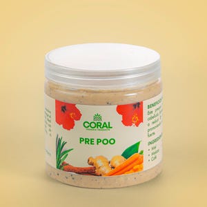 May include: A clear plastic jar with a white lid, labeled "PRE POO" with the "CORAL ORGANIC PRODUCTS" logo. The jar contains a beige substance and illustrations of ginger, carrots, and hibiscus flowers.