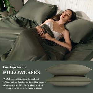 May include: A set of two green pillowcases with an envelope closure. The pillowcases have a delicate edge piping throughout and an extra deep flap to keep the pillow secure. The pillowcases are available in queen size (20 inches by 30 inches) and king size (20 inches by 36 inches).