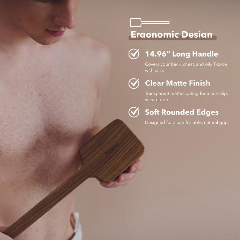 May include: A wooden back scrubber with a long handle, approximately 15 inches, and a clear matte finish. The scrubber has soft, rounded edges for a comfortable grip. The text on the image says "Eraonomic Desian".