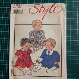 May include: Vintage baby dress sewing pattern. The cover shows illustrations of three babies in various dresses. The dresses are red with white spots, blue with a white collar, and floral. The word "Style" is written in red script across the top.