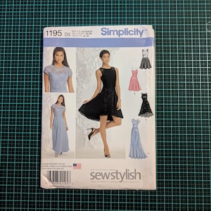 May include: Simplicity sewing pattern 1195 D5. The pattern features illustrations of various dress designs, including a black lace dress and a light blue gown. The package includes the text "sewstylish" and size information.