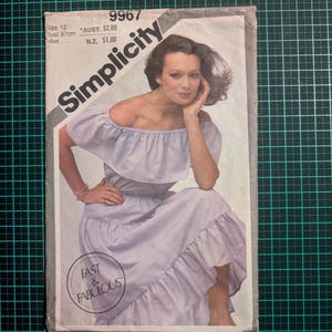 May include: Simplicity sewing pattern number 9967 for a dress with a ruffled neckline and skirt. The pattern is for size 12, bust 87 cm. The pattern is labelled "Fast & Fabulous".