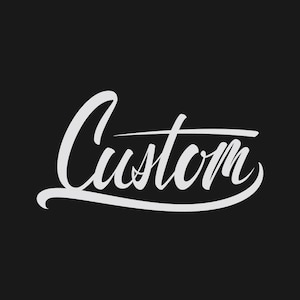 May include: White cursive text that reads "Custom" on a black background. The word is stylized with a flowing script and a horizontal line underlining the word. The overall design is simple and elegant.