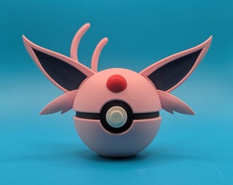 May include: A pink and black 3D printed Pokemon Eevee figurine in the shape of a Pokeball.
