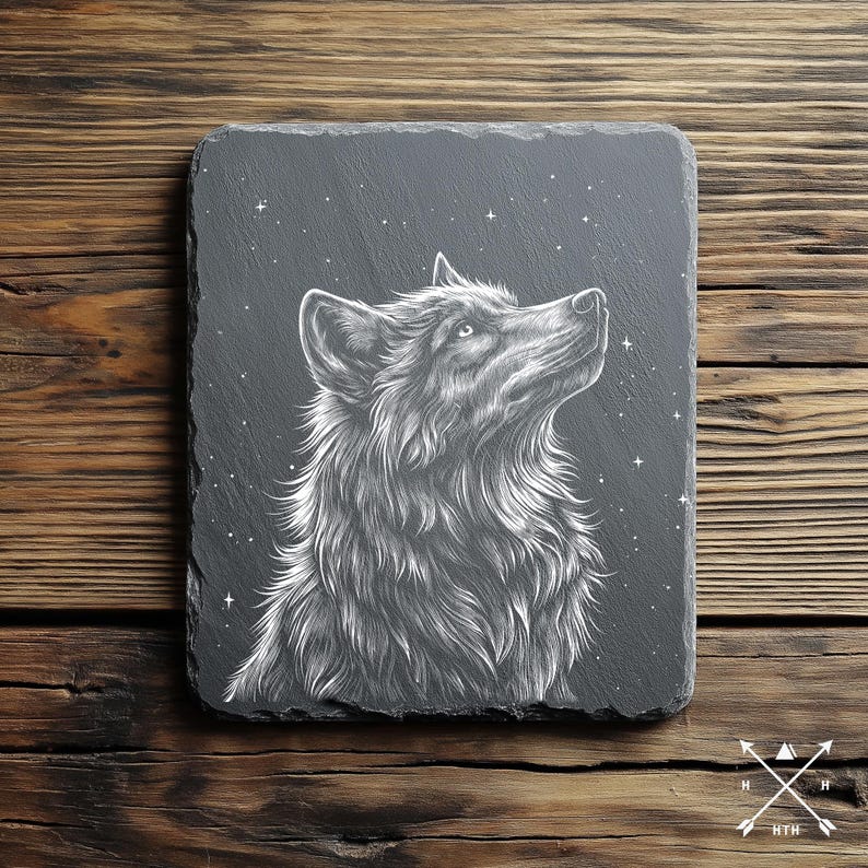May include: A black slate coaster with a white line drawing of a wolf howling at the moon. The wolf is surrounded by white stars.