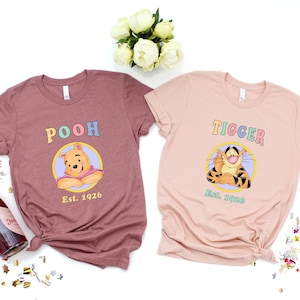 Pastell Pooh T-Shirt, Winnie the Pooh Tigger Piglet Eeyore Charakter T-Shirt, süßes Cartoon Freunde Kreis Grafik Shirt