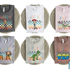 Toy Story Character Grid T-Shirt, Woody Jessie Buzz Alien Rex Tee, Pixar Toy Story Shirt for Kids and Fans, Colorful Block Style Toy Shirt