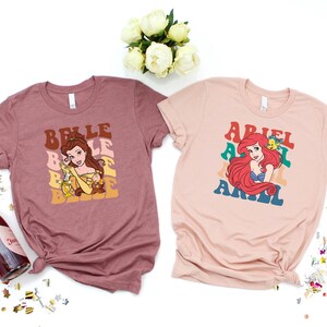 ディズニープリンセスシャツ、レトロディズニープリンセスTシャツ、ディズニーガールズトリップスウェットシャツ、ディズニーオールプリンセススウェットシャツ、ディズニーキャラクターシャツ