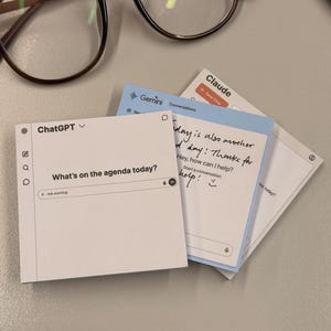 May include: Three square sticky notes featuring printed interfaces for ChatGPT, Gemini, and Claude. The ChatGPT note displays the text What's on the agenda today? and Ask anything. The Gemini note includes handwritten text. Brown-rimmed eyeglasses are positioned above.