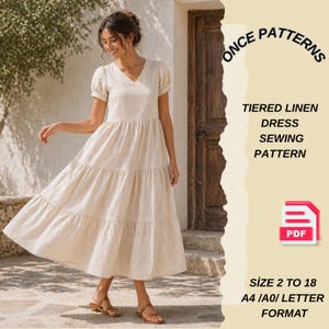 Pode incluir: Uma mulher usando um vestido de linho bege em camadas com mangas curtas e decote em V. O vestido é um padrão de costura, com o texto "ONCE PATTERNS, TIERED LINEN DRESS SEWING PATTERN, PDF, SIZE 2 TO 18, A4/A0/LETTER FORMAT."