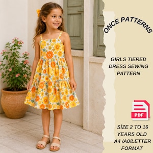 May include: A young girl wearing a yellow tiered dress with a floral pattern. The dress has thin straps and a ruffled skirt. The image also includes text that reads "ONCE PATTERNS" and "GIRLS TIERED DRESS SEWING PATTERN". The pattern is for sizes 2 to 16 years old.