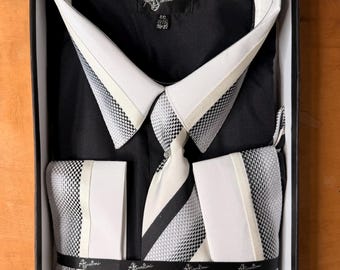 Completo da uomo Santoni nero con camicia, cravatta, gemelli e fazzoletto.